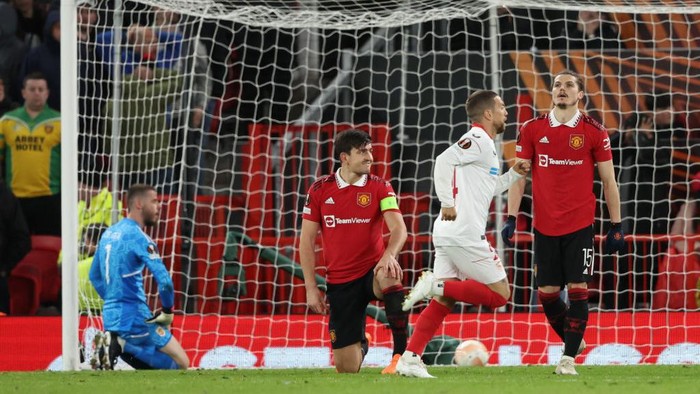 MANCHESTER, ENGLAND - APRIL 13: Harry Maguire of Manchester United reacts after scoring an own goal to make it 2-2 during the UEFA Europa League quarterfinal first leg match between Manchester United and Sevilla FC at Old Trafford on April 13, 2023 in Manchester, United Kingdom. (Photo by Matthew Ashton - AMA/Getty Images)