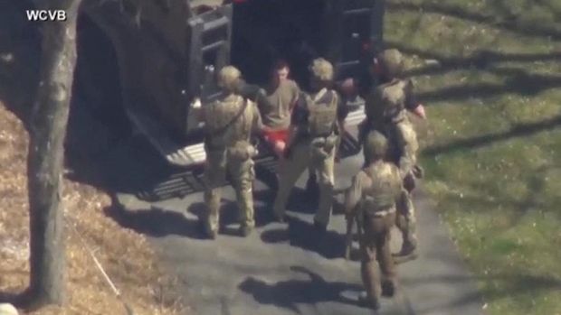 FBI agents arrest Jack Teixeira, an employee of the U.S. Air Force National Guard, in connection with an investigation into the leaks online of classified U.S. documents, outside a residence in this still image taken from video in North Dighton, Massachusetts, U.S., April 13, 2023. WCVB-TV via ABC via REUTERS. ATTENTION EDITORS - NO SALES NO ARCHIVES THIS IMAGE HAS BEEN SUPPLIED BY A THIRD PARTY MANDATORY CREDIT