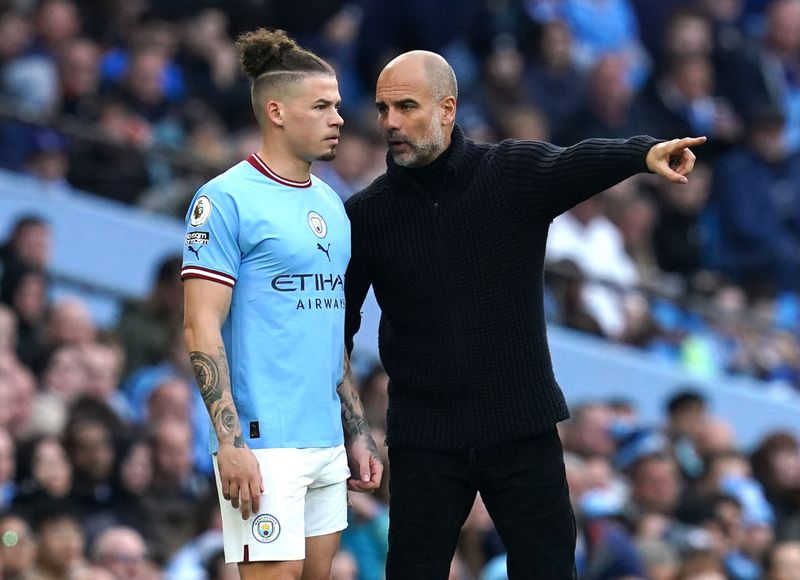 Manchester City manager Pep Guardiola (right) speaks to Kalvin Phillips ahead of being substituted on during the Premier League match at the Etihad Stadium, Manchester. Picture date: Saturday April 15, 2023. (Photo by Nick Potts/PA Images via Getty Images)