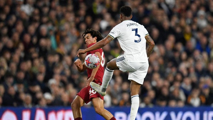 Trent Alexander-Arnold, Liverpool vs Leeds Liverpool's English defender Trent Alexander-Arnold (L) appears to use an arm in blocking a pass from Leeds United's Spanish defender Junior Firpo (R) in the build-up to the first goal during the English Premier League football match between Leeds United and Liverpool at Elland Road in Leeds, northern England on April 17, 2023. (Photo by Oli SCARFF / AFP) / RESTRICTED TO EDITORIAL USE. No use with unauthorized audio, video, data, fixture lists, club/league logos or 'live' services. Online in-match use limited to 120 images. An additional 40 images may be used in extra time. No video emulation. Social media in-match use limited to 120 images. An additional 40 images may be used in extra time. No use in betting publications, games or single club/league/player publications. / (Photo by OLI SCARFF/AFP via Getty Images)
