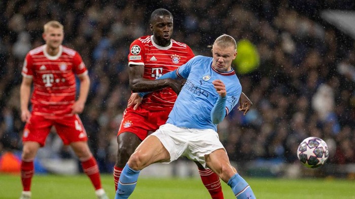 MANCHESTER, ENGLAND - APRIL 11: Dayot Upamecano of Bayern Munich and Erling Haaland of Manchester City battle for the ball during the UEFA Champions League quarterfinal first leg match between Manchester City and FC Bayern München at Etihad Stadium on April 11, 2023 in Manchester, England. (Photo by Richard Callis ATPImages/Getty Images)