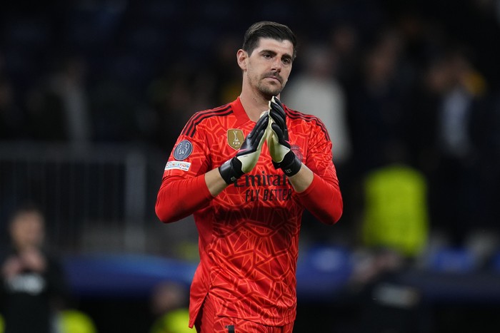 Thibaut Courtois Real Madrid's goalkeeper Thibaut Courtois applauds after the Champions League quarterfinal, first leg, soccer match between Real Madrid and Chelsea at the Santiago Bernabeu stadium in Madrid, Spain, Wednesday, April 12, 2023. Real won 2-0. (AP Photo/Manu Fernandez)