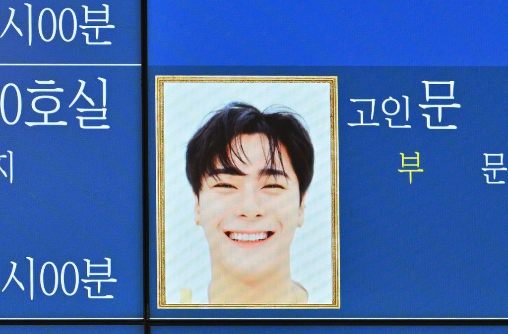 A portrait of Moonbin, a member of K-pop boy band Astro, is seen on an electronic board outside a funeral hall at a hospital in Seoul on April 20, 2023. - K-pop star Moonbin, a member of the boy band Astro, has died, his music label and South Korean police said on April 20, prompting an outpouring of grief from fans. (Photo by Jung Yeon-je / AFP) (Photo by JUNG YEON-JE/AFP via Getty Images)