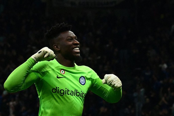 Inter Milans Cameroonian goalkeeper Andre Onana celebrates after Inter scored their third goal during the UEFA Champions League quarter-finals second leg football match between Inter Milan and Benfica Lisbon on April 19, 2023 at the Giuseppe-Meazza (San Siro) stadium in Milan. (Photo by Vincenzo PINTO / AFP) (Photo by VINCENZO PINTO/AFP via Getty Images)