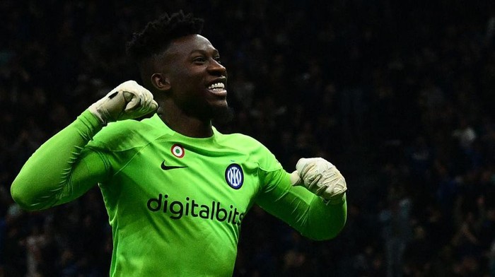Inter Milans Cameroonian goalkeeper Andre Onana celebrates after Inter scored their third goal during the UEFA Champions League quarter-finals second leg football match between Inter Milan and Benfica Lisbon on April 19, 2023 at the Giuseppe-Meazza (San Siro) stadium in Milan. (Photo by Vincenzo PINTO / AFP) (Photo by VINCENZO PINTO/AFP via Getty Images)