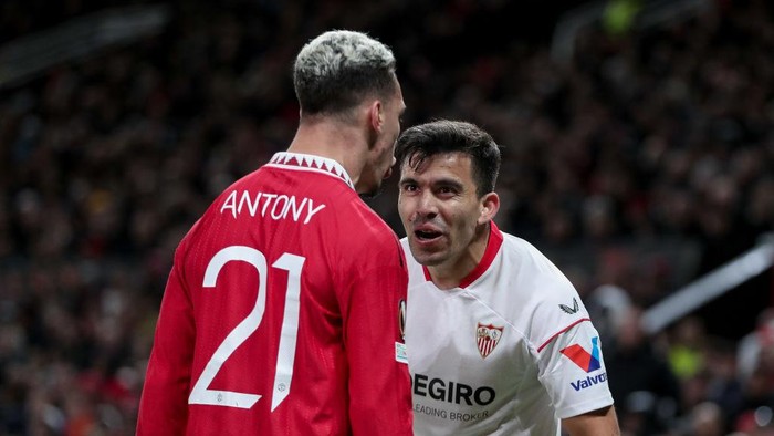 MANCHESTER, ENGLAND - APRIL 13: Antony of Manchester United and Marcos Acuna of Sevilla FC look on during the UEFA Europa League quarterfinal first leg match between Manchester United and Sevilla FC at Old Trafford on April 13, 2023 in Manchester, United Kingdom. (Photo by Michael Zemanek/DeFodi Images via Getty Images)