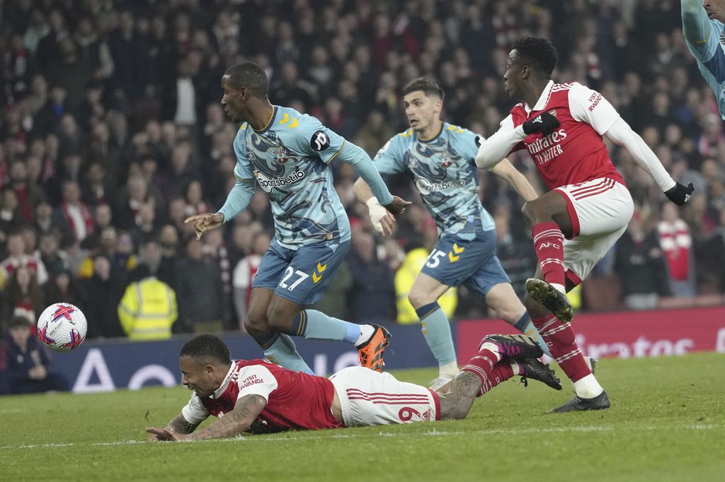 Arsenal's Gabriel Jesus, bottom, lies on the pitch during the English Premier League soccer match between Arsenal and Southampton at Emirates stadium in London, Friday, April 21, 2023. (AP Photo/Kirsty Wigglesworth)