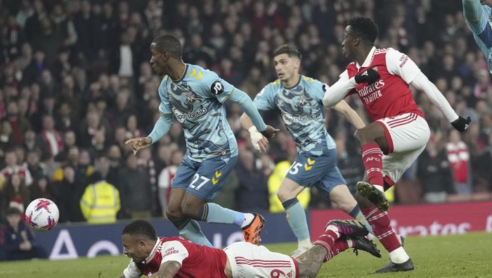 Arsenals Gabriel Jesus, bottom, lies on the pitch during the English Premier League soccer match between Arsenal and Southampton at Emirates stadium in London, Friday, April 21, 2023. (AP Photo/Kirsty Wigglesworth)