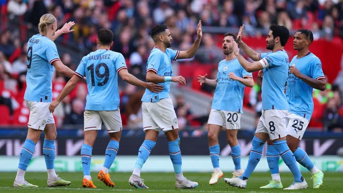 LONDON, ENGLAND - APRIL 22: Riyad Mahrez of Manchester City celebrates scoring his first goal with team mates during the Emirates FA Cup Semi Final match between Manchester City and Sheffield United at Wembley Stadium on April 22, 2023 in London, England. (Photo by Marc Atkins/Getty Images)