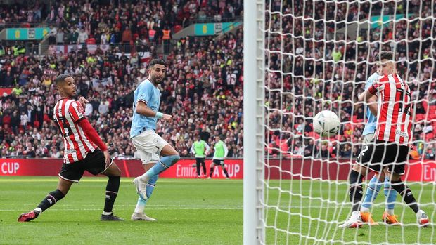 LONDON, ENGLAND - APRIL 22: Riyad Mahrez of Manchester City scores their 3rd goal, achieving a hat-trick during the FA Cup Semi-Final between Manchester City and Sheffield United at Wembley Stadium on April 22, 2023 in London, England. (Photo by Mark Leech/Offside/Offside via Getty Images)