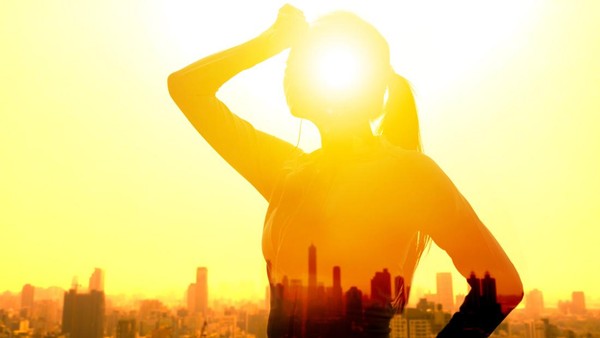 Double exposure portrait of  young fitness Woman hand wiping sweat and  summer heat wave concept