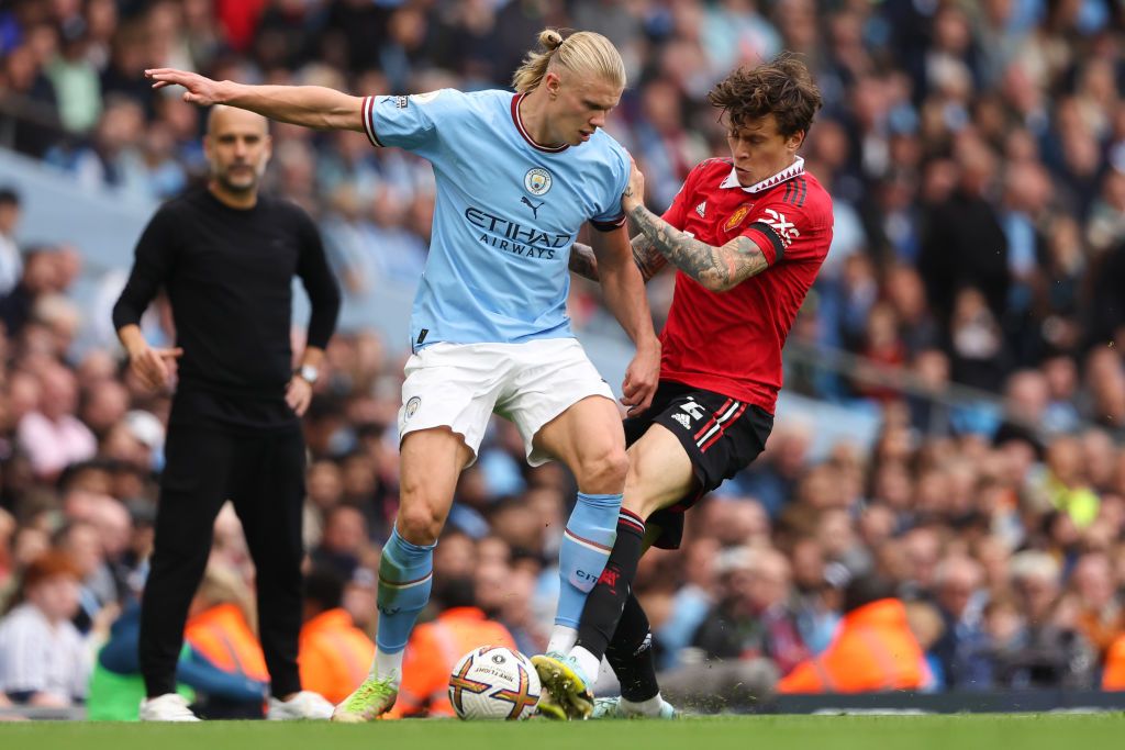 MANCHESTER, ENGLAND - OCTOBER 02: Erling Haaland of Manchester City and Victor Lindelof of Manchester United during the Premier League match between Manchester City and Manchester United at Etihad Stadium on October 2, 2022 in Manchester, United Kingdom. (Photo by Matthew Ashton - AMA/Getty Images)