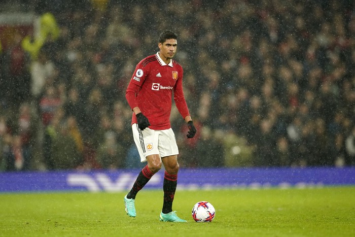 Manchester Uniteds Raphael Varane controls the ball during the English Premier League soccer match between Manchester United and Brentford, at the Old Trafford stadium in Manchester, England, Wednesday, April 5, 2023. (AP Photo/Dave Thompson)