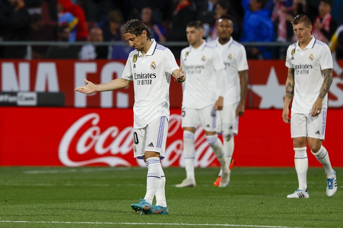 Real Madrids Luka Modric, left, reacts after Gironas Taty Castellanos scored his sides third goal during a Spanish La Liga soccer match between Girona and Real Madrid, at the Montilivi stadium in Girona, Spain, Tuesday, April 25, 2023. (AP Photo/Joan Monfort)