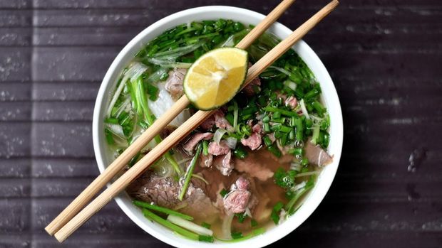 This photograph taken on August 18, 2020 shows a bowl of pho at an eatery in Hanoi. - An -- a 28-year-old architecture graduate -- began crafting food miniatures made from clay a year ago, spotting a chance to capitalise on the world's growing love for Vietnamese cuisine. (Photo by Manan VATSYAYANA / AFP)