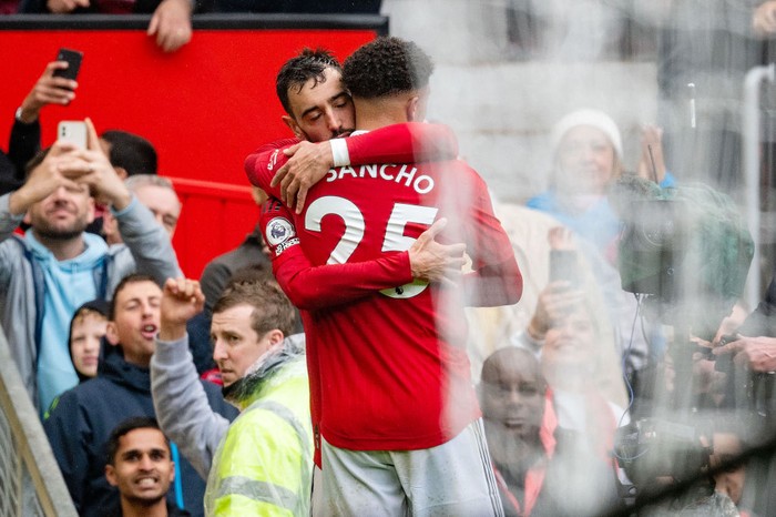 MANCHESTER, ENGLAND - APRIL 30: Bruno Fernandes of Manchester United celebrates with team mate Jadon Sancho after scoring their sides first goal during the Premier League match between Manchester United and Aston Villa at Old Trafford on April 30, 2023 in Manchester, England. (Photo by Ash Donelon/Manchester United via Getty Images)