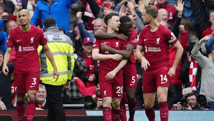 Liverpools Diogo Jota, 2nd left, celebrates with team mates after scoring his sides fourth goal during an English Premier League soccer match between Liverpool and Tottenham Hotspur at Anfield stadium in Liverpool, Sunday, April 30, 2023. (AP Photo/Jon Super)