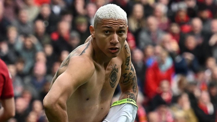 Tottenham Hotspurs Brazilian striker Richarlison celebrates after scoring their third goal during the English Premier League football match between Liverpool and Tottenham Hotspur at Anfield in Liverpool, north west England on April 30, 2023. - Liverpool won the game 4-3. (Photo by Paul ELLIS / AFP) / RESTRICTED TO EDITORIAL USE. No use with unauthorized audio, video, data, fixture lists, club/league logos or live services. Online in-match use limited to 120 images. An additional 40 images may be used in extra time. No video emulation. Social media in-match use limited to 120 images. An additional 40 images may be used in extra time. No use in betting publications, games or single club/league/player publications. /  (Photo by PAUL ELLIS/AFP via Getty Images)