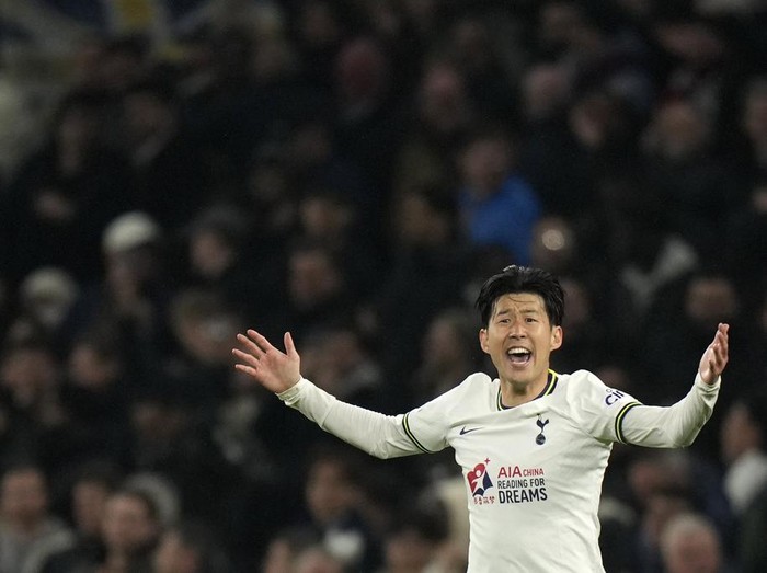 Tottenham's Son Heung-min celebrates after scoring his sides second goal during the English Premier League soccer match between Tottenham Hotspur and Manchester United at White Hart Lane, in London, England, Thursday, April 27, 2023. (AP Photo/Alastair Grant)