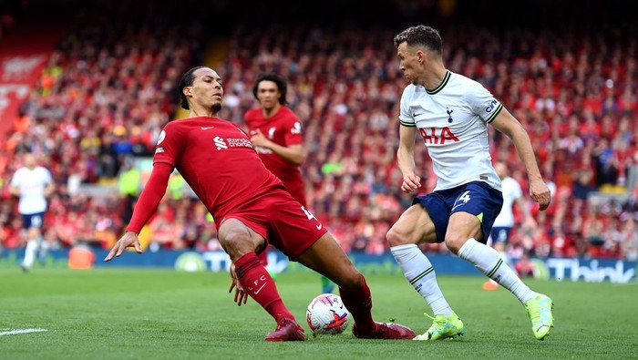 Virgil van Dijk LIVERPOOL, ENGLAND - APRIL 30: Virgil van Dijk of Liverpool slips whilst under pressure from Ivan Perisic of Tottenham Hotspur during the Premier League match between Liverpool FC and Tottenham Hotspur at Anfield on April 30, 2023 in Liverpool, England. (Photo by Michael Regan/Getty Images)