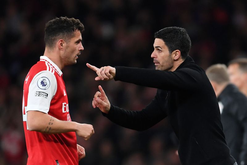 LONDON, ENGLAND - MAY 02: Mikel Arteta, Manager of Arsenal, gives instructions to Granit Xhaka during the Premier League match between Arsenal FC and Chelsea FC at Emirates Stadium on May 02, 2023 in London, England. (Photo by Stuart MacFarlane/Arsenal FC via Getty Images)