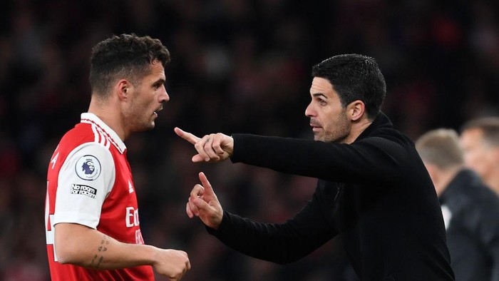LONDON, ENGLAND - MAY 02: Mikel Arteta, Manager of Arsenal, gives instructions to Granit Xhaka during the Premier League match between Arsenal FC and Chelsea FC at Emirates Stadium on May 02, 2023 in London, England. (Photo by Stuart MacFarlane/Arsenal FC via Getty Images)