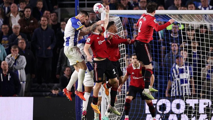 BRIGHTON, ENGLAND - MAY 04: Lewis Dunk of Brighton & Hove Albion shoots which hits the hand of Luke Shaw of Manchester United, which results in a penalty being awarded to Brighton & Hove Albion after a VAR review for handball to during the Premier League match between Brighton & Hove Albion and Manchester United at American Express Community Stadium on May 04, 2023 in Brighton, England. (Photo by Ryan Pierse/Getty Images)