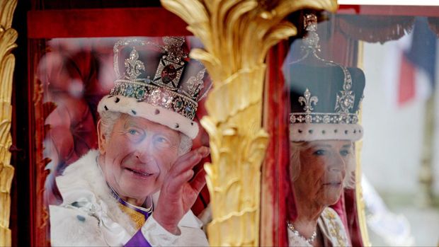 LONDON, ENGLAND - MAY 06: King Charles III and Queen Camilla travelling in the Gold State Coach built in 1760 and used at every Coronation since that of William IV in 1831sets off from Westminster Abbey on route to Buckingham Palace during the Coronation of King Charles III and Queen Camilla on May 06, 2023 in London, England. The Coronation of Charles III and his wife, Camilla, as King and Queen of the United Kingdom of Great Britain and Northern Ireland, and the other Commonwealth realms takes place at Westminster Abbey today. Charles acceded to the throne on 8 September 2022, upon the death of his mother, Elizabeth II.     Rob Pinney/Pool via REUTERS