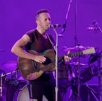 LOS ANGELES, CALIFORNIA - OCTOBER 23: Chris Martin of Coldplay performs onstage during the 8th annual 