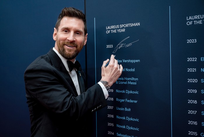 PARIS, FRANCE - MAY 08:  Lionel Messi winner of the Laureus World Sportsman of the Year 2023 award signs the wall at the Montblanc Signing Wall during the 2023 Laureus World Sport Awards Paris at Cour Vendome on May 08, 2023 in Paris, France. (Photo by Alexander Scheuber/Getty Images for Laureus)