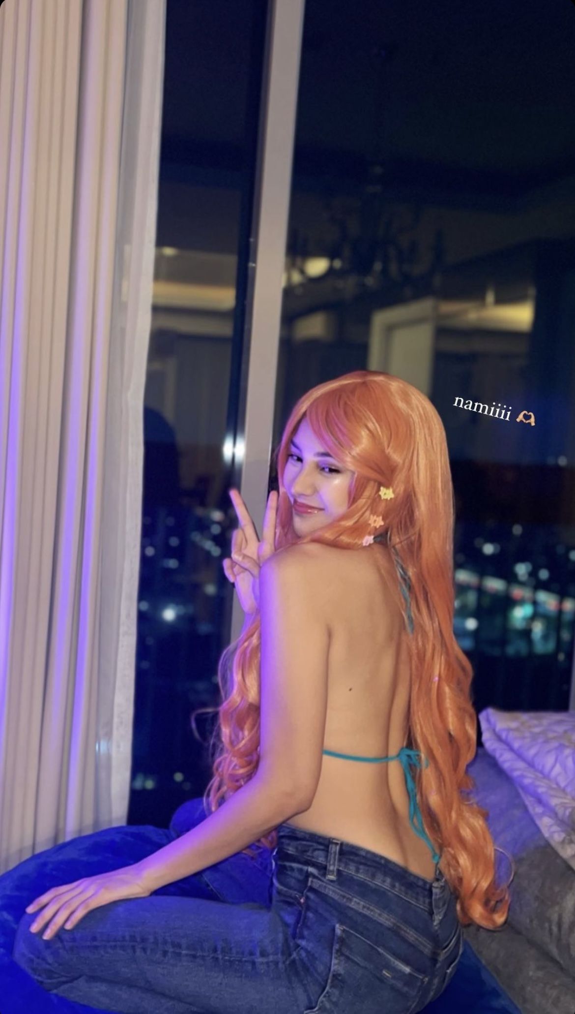 Anya Geraldin saat cosplay menjadi Nami One Piece Anya Geraldin saat cosplay menjadi Nami One Piece