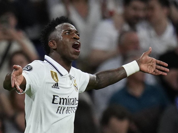 Real Madrid's Vinicius Junior celebrates after scoring the opening goal during the Champions League semifinal first leg soccer match between Real Madrid and Manchester City at the Santiago Bernabeu stadium in Madrid, Spain, Tuesday, May 9, 2023. (AP Photo/Manu Fernandez)