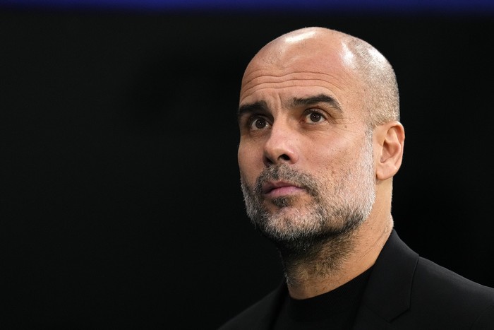 Manchester Citys head coach Pep Guardiola arrives for the Champions League semifinal first leg soccer match between Real Madrid and Manchester City at the Santiago Bernabeu stadium in Madrid, Spain, Tuesday, May 9, 2023. (AP Photo/Manu Fernandez)