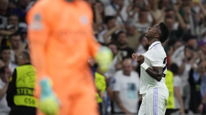 Real Madrids Vinicius Junior celebrates after scoring the opening goal during the Champions League semifinal first leg soccer match between Real Madrid and Manchester City at the Santiago Bernabeu stadium in Madrid, Spain, Tuesday, May 9, 2023. (AP Photo/Manu Fernandez)