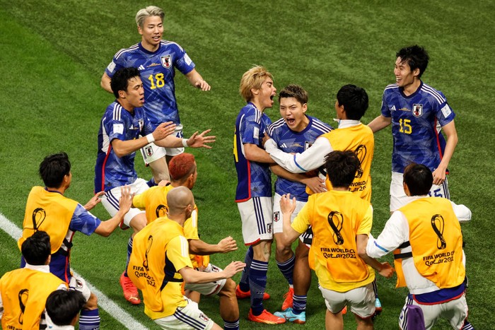 DOHA, QATAR - NOVEMBER 23: Doan Ritsu #8 of Japan celebrates his goal with teammates during the FIFA World Cup Qatar 2022 Group E match between Germany and Japan at Khalifa International Stadium on November 23, 2022 in Doha, Qatar. (Photo by Zhizhao Wu/Getty Images)