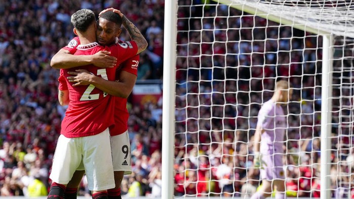 Manchester Uniteds Anthony Martial celebrates with Manchester Uniteds Antony after scoring his sides opening goal during the English Premier League soccer match between Manchester United and Wolverhampton at the Old Trafford stadium in Manchester, England, Saturday, May 13, 2023. (AP Photo/Jon Super)