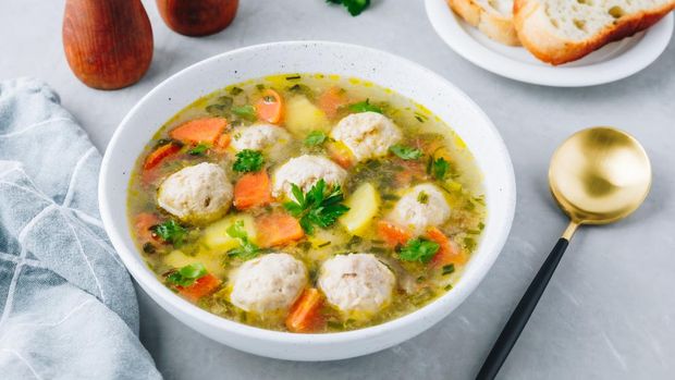 Meatballs soup. Chicken turkey vegetables meatballs soup with carrots and potatoes.