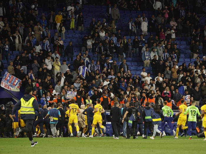 Soccer Football - LaLiga - Espanyol v Barcelona - RCDE Stadium, Cornella de Llobregat, Spain - May 14, 2023
Espanyol fans invade the pitch and pick up a bench after the match REUTERS/Albert Gea