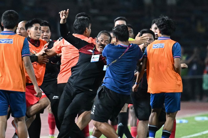 A fight breaks out on the sidelines of the mens football final match between Thailand and Indonesia during the 32nd Southeast Asian Games (SEA Games) in Phnom Penh on May 16, 2023. (Photo by MOHD RASFAN / AFP) (Photo by MOHD RASFAN/AFP via Getty Images)