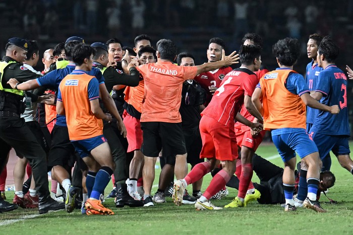 Players and officials gather as a fight breaks out on the sidelines of the mens football final match between Thailand and Indonesia during the 32nd Southeast Asian Games (SEA Games) in Phnom Penh on May 16, 2023. (Photo by MOHD RASFAN / AFP) (Photo by MOHD RASFAN/AFP via Getty Images)