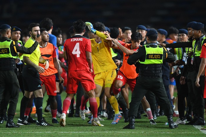 Security officials gather after a fight breaks out on the sidelines of the mens football final match between Indonesia and Thailand during the 32nd Southeast Asian Games (SEA Games) in Phnom Penh on May 16, 2023. (Photo by Nhac NGUYEN / AFP) (Photo by NHAC NGUYEN/AFP via Getty Images)