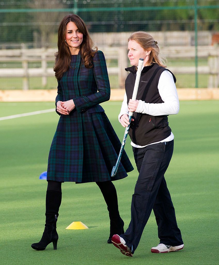PANGBOURNE, UNITED KINGDOM - NOVEMBER 30:  Catherine, Duchess of Cambridge (L) takes part in a day of activities and festivities to mark the occasion of St Andrew's Day at St Andrew's School on November 30, 2012 in Pangbourne, Berkshire, England. The Duchess visited the Pre-Prep School for under-5s, unveiled a plaque to officially open a new artificial turf playing field and met members of the school's hockey team, which she played for during her time as a pupil at the school (1986-1995). The Duchess also toured the school privately and watched the school's Progressive Games which are traditional games played indoors by teachers and students on St. Andrew's Day.  (Photo by Arthur Edwards - WPA Pool/Getty Images)