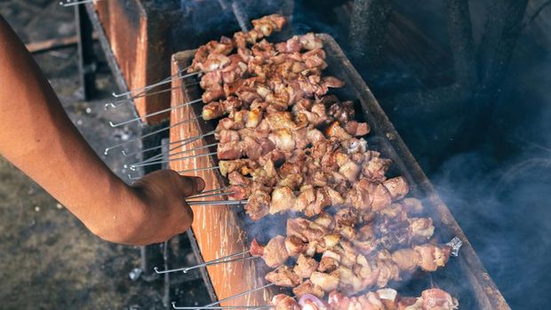 Sate Klatak grilling on charcoal grill. Sate klathak is a unique goat satay or mutton satay dish, originally from Yogyakarta, Indonesia.
