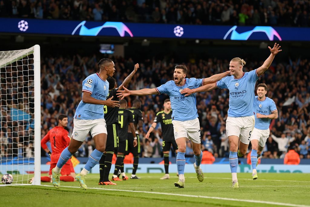 MANCHESTER, ENGLAND - MAY 17: Manuel Akanji celebrates with Erling Haaland of Manchester City after an own goal by Eder Militao of Real Madrid (not pictured) Manchester City's third goal during the UEFA Champions League semi-final second leg match between Manchester City FC and Real Madrid at Etihad Stadium on May 17, 2023 in Manchester, England. (Photo by Michael Regan/Getty Images)