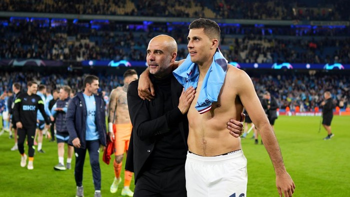 MANCHESTER, ENGLAND - MAY 17: Pep Guardiola and Rodri of Manchester City celebrate after the teams victory during the UEFA Champions League semi-final second leg match between Manchester City FC and Real Madrid at Etihad Stadium on May 17, 2023 in Manchester, England. (Photo by Lexy Ilsley - Manchester City/Manchester City FC via Getty Images)