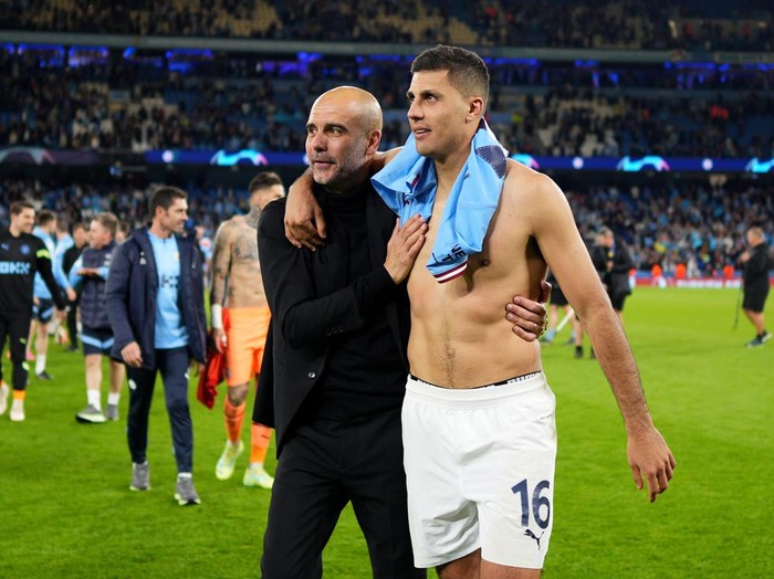 MANCHESTER, ENGLAND - MAY 17: Pep Guardiola and Rodri of Manchester City celebrate after the team's victory during the UEFA Champions League semi-final second leg match between Manchester City FC and Real Madrid at Etihad Stadium on May 17, 2023 in Manchester, England. (Photo by Lexy Ilsley - Manchester City/Manchester City FC via Getty Images)