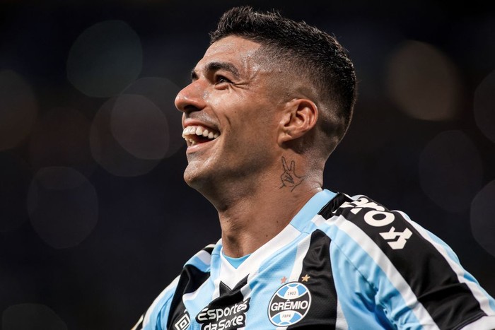 Gremios Uruguayan forward Luis Suarez celebrates after scoring a goal from the penalty spot during the second leg final match of the Rio Grande do Sul State Championship, better known as the Gaucho Championship, against Caxias, at the Arena do Gremio stadium in Porto Alegre, Brazil on April 8, 2023. - Luis Suarez causes a stir in Porto Alegres Gremio. His face is printed on flags, his number 9 t-shirt sold out and stadium attendances have doubled. In just four months, the Uruguayan is already a top goal scorer and two-times champion. (Photo by Silvio AVILA / AFP) (Photo by SILVIO AVILA/AFP via Getty Images)