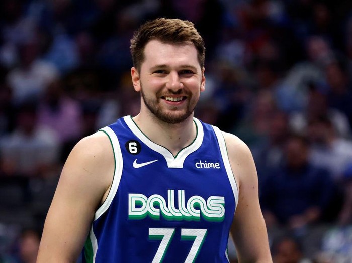 DALLAS, TX - APRIL 5: Luka Doncic #77 of the Dallas Mavericks reacts as the Mavericks play the Sacramento Kings in the second half at American Airlines Center on April 5, 2023 in Dallas, Texas. The Mavericks won 123-119. NOTE TO USER: User expressly acknowledges and agrees that, by downloading and or using this photograph, User is consenting to the terms and conditions of the Getty Images License Agreement. (Photo by Ron Jenkins/Getty Images)