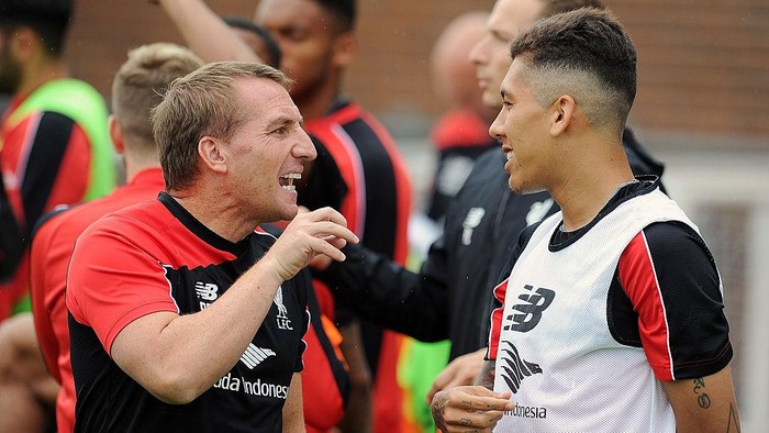 LIVERPOOL, ENGLAND - AUGUST 22:  (THE SUN OUT, THE SUN ON SUNDAY OUT) Brendan Rodgers manger of Liverpool talks with Roberto Firmino during a training session at Melwood Training Ground on August 22, 2015 in Liverpool, England.  (Photo by Andrew Powell/Liverpool FC via Getty Images)