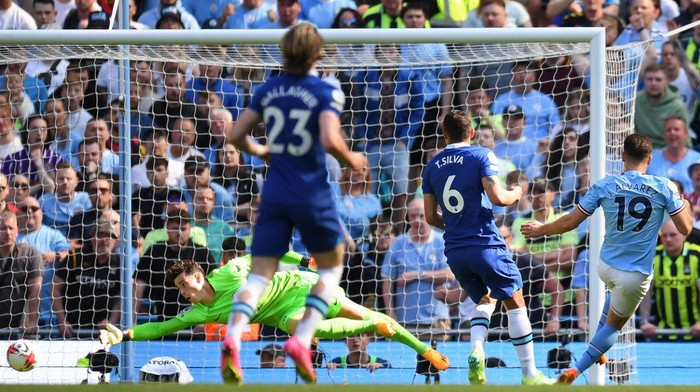 Manchester Citys Argentinian striker Julian Alvarez (R) scores the opening goal during the English Premier League football match between Manchester City and Chelsea at the Etihad Stadium in Manchester, north west England, on May 21, 2023. (Photo by Oli SCARFF / AFP) / RESTRICTED TO EDITORIAL USE. No use with unauthorized audio, video, data, fixture lists, club/league logos or live services. Online in-match use limited to 120 images. An additional 40 images may be used in extra time. No video emulation. Social media in-match use limited to 120 images. An additional 40 images may be used in extra time. No use in betting publications, games or single club/league/player publications. /  (Photo by OLI SCARFF/AFP via Getty Images)